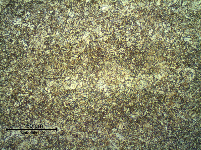 Micrography of the base metal showing a quenched and tempered martensitic structure. The base metal adopted in the test coupon presented a hardness level of 217HB (Brinell hardness of the certificate) and after the PWHT cycle the measured base metal hardness is 224 HV10.