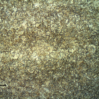Micrography of the base metal showing a quenched and tempered martensitic structure. The base metal adopted in the test coupon presented a hardness level of 217HB (Brinell hardness of the certificate) and after the PWHT cycle the measured base metal hardness is 224 HV10.