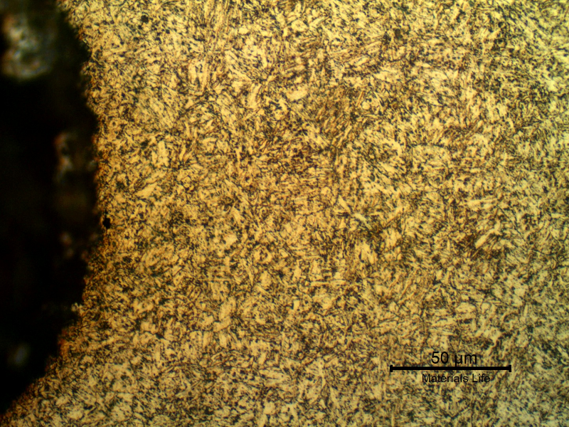 Micrographic detail of the rolled thread that was heat treated later. The bolt was quenched and tempered to 30 HRc and presented a martensitic structure.