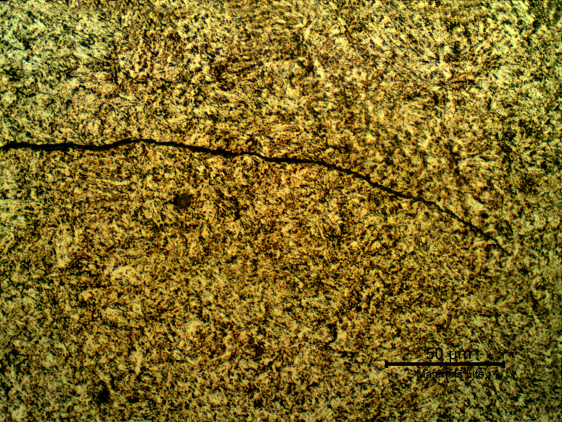 Micrographic detail of the cracking adjacent to the fracture. It is a secondary cracking that was created by overloading and was  propagating by fatigue.
