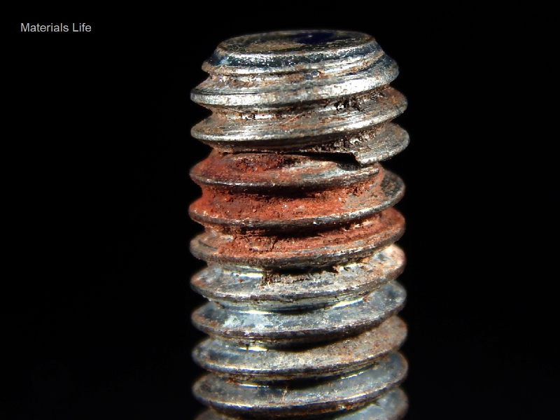 The corrosion marks in the thread surface indicate that the bolt was not properly tightened in the tapped hole.  The length of thread engagement should be at least  1x of the bolt diameter, in this case 3/8".