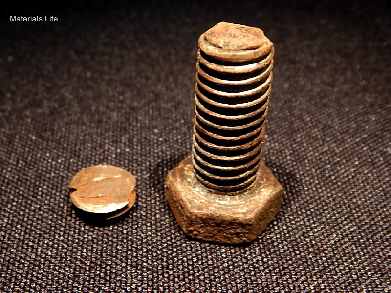The four bolts have fractured in the same position, close to the end, and the corrosion marks in the thread suggest that they have been tightened only a few fillets in a tapped hole. This condition could be responsible for overloading the fillets, relaxing the applied bolt preload, and intensifying cyclic stresses.