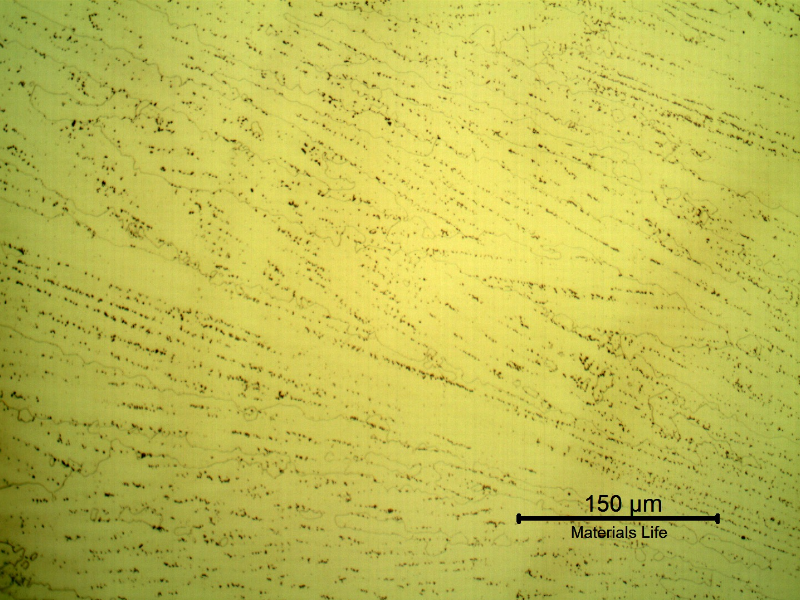 Micrography of a longitudinal section of the pipe at the interface between overlay layers, with electrolytic etch that reveals the Ni alloy structure, large grains with celular dendritic morphology.