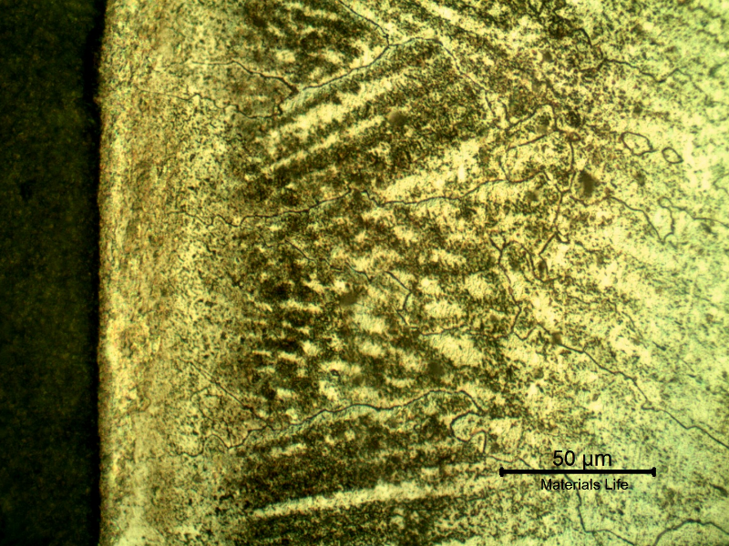 Micrographic detail of a longitudinal section of the pipe at the interface,with oxalic acid electrolytic revealing the structure of the clad interface. Celular structure and transgranular precipitation.