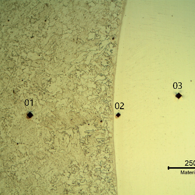 Micrography showing the positions of Vickers microhardness measurements in the longitudinal micrography, in the pipe steel substrate (dot 1 - 217 HV100g), very close to the interface inside the overlay (dot 2 - 370 HV100g) and a little far from the interface inside the Ni clad plate (dot 3 - 229 HV100g).