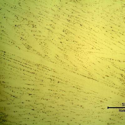 Micrography of a longitudinal section of the pipe at the interface between overlay layers, with electrolytic etch that reveals the Ni alloy structure, large grains with celular dendritic morphology.