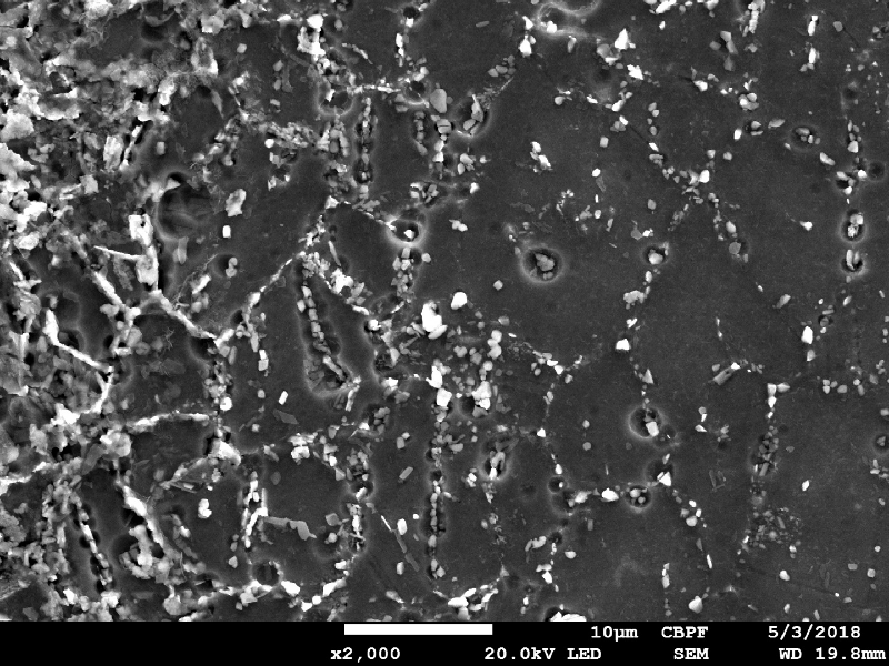 Image by scanning electron microscopy of the metallurgically bonded interface of the internally cladded pipe.  It is a longitudinal seam welded pipe, with substrate in low alloy steel X65 and clad plate in Alloy 625 (welded by a solid state process). The region is a detail in the side of the Ni alloy clad plate where a grain refinement has occurred probably due to recrystallization of a strain hardened region during later heat treatment. The microhardness of this region is a lot higher than the value obtained out of this region, in the clad plate.