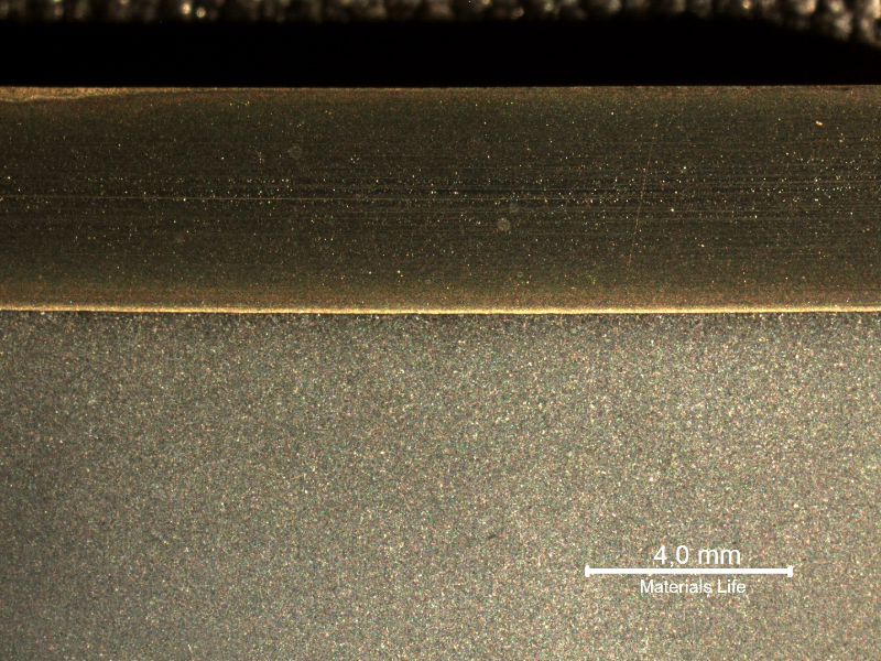 The macrography of a longitudinal section shows the low alloy (C-Mn) steel pipe, internally cladded with Ni alloy clad plate.