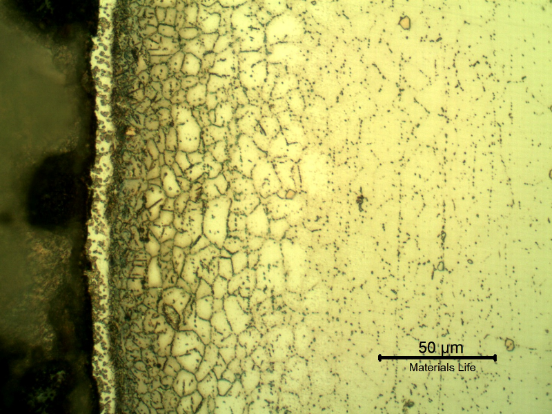 Micrographic detail of the metallurgically bonded interface of the internally cladded pipe. The region is a detail in the side of the Ni alloy clad plate where a grain refinement has occurred probably due to recrystallization of a strain hardened region during later heat treatment. The microhardness very close to the interface (429 HV100g) is higher than the value of 358HV 100g ,obtained 0.2mm far from this region in the clad plate .