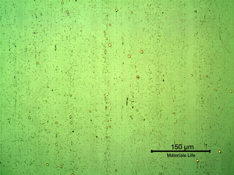 Micrography of a longitudinal section of the pipe at the clad plate, with electrolytic etch, that sligthly reveals the granular structure of the clad plate, with some precipitates.