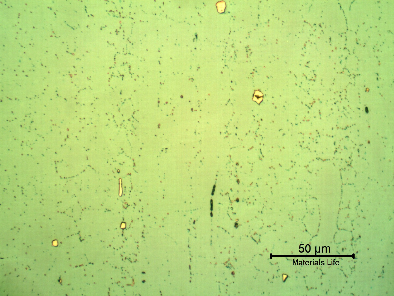 Micrographic detail of a longitudinal section of the pipe at the clad plate, with electrolytic etch, that sligthly reveals the granular structure of the plate, mainly due to the presence if precipitates.