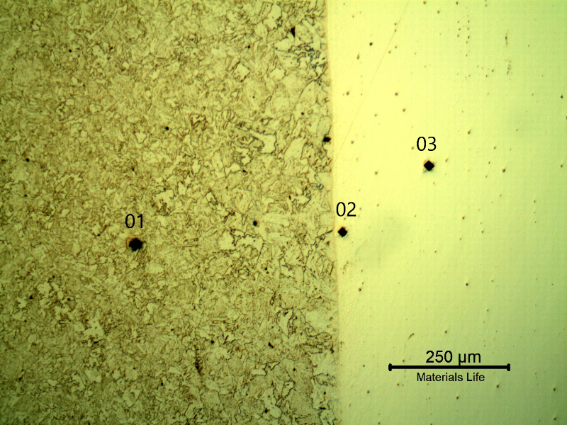 Micrography showing the positions of Vickers microhardness measurements in the longitudinal micrography, in the pipe steel substrate (dot 1 - 266 HV100g), very close to the interface inside the clad plate (dot 2 - 429 HV100g) and a little far from the interface inside the Ni clad plate (dot 3 - 358 HV100g).
