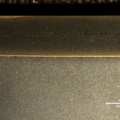 The macrography of a longitudinal section shows the low alloy (C-Mn) steel pipe, internally cladded with Ni alloy clad plate.