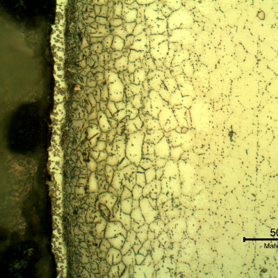 Micrographic detail of the metallurgically bonded interface of the internally cladded pipe. The region is a detail in the side of the Ni alloy clad plate where a grain refinement has occurred probably due to recrystallization of a strain hardened region during later heat treatment. The microhardness very close to the interface (429 HV100g) is higher than the value of 358HV 100g ,obtained 0.2mm far from this region in the clad plate .