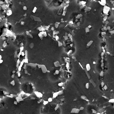 Image by scanning electron microscopy of the metallurgically bonded interface of the internally cladded pipe.  It is a longitudinal seam welded pipe, with substrate in low alloy steel X65 and clad plate in Alloy 625 (welded by a solid state process). The region is a detail in the side of the Ni alloy clad plate where a grain refinement has occurred probably due to recrystallization of a strain hardened region during later heat treatment. The microhardness of this region is a lot higher than the value obtained out of this region, in the clad plate.