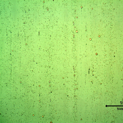 Micrography of a longitudinal section of the pipe at the clad plate, with electrolytic etch, that sligthly reveals the granular structure of the clad plate, with some precipitates.