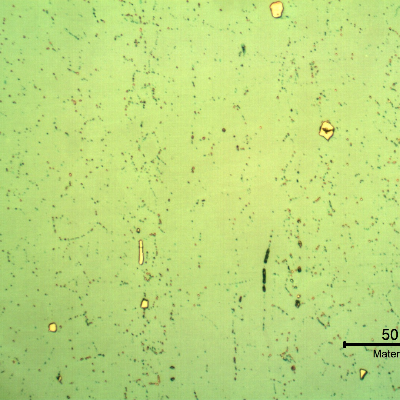 Micrographic detail of a longitudinal section of the pipe at the clad plate, with electrolytic etch, that sligthly reveals the granular structure of the plate, mainly due to the presence if precipitates.