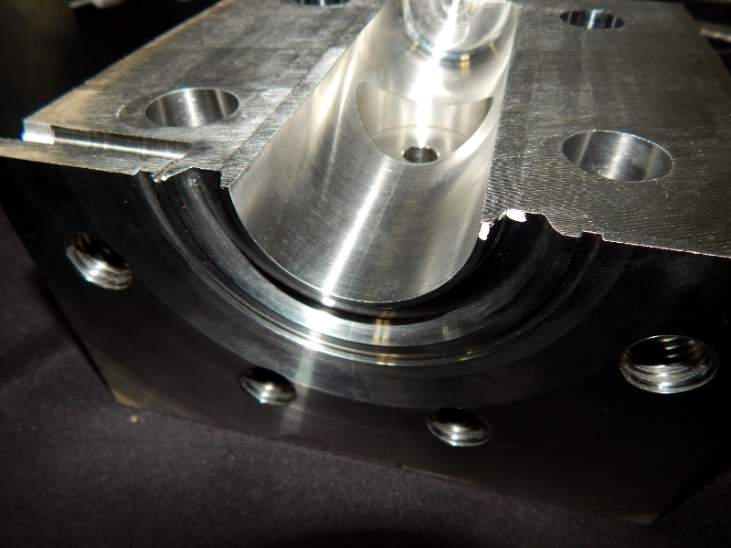 Aspect of a section cut transverse to the center of the body. The crack is brittle, trough wall, and was arrested in the region where the valve body was welded to the insert.