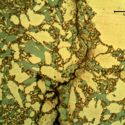 Micrographic aspect of the cracking.  It is brittle, transgranular and associated to the ferritic/sigma phase interfaces.
