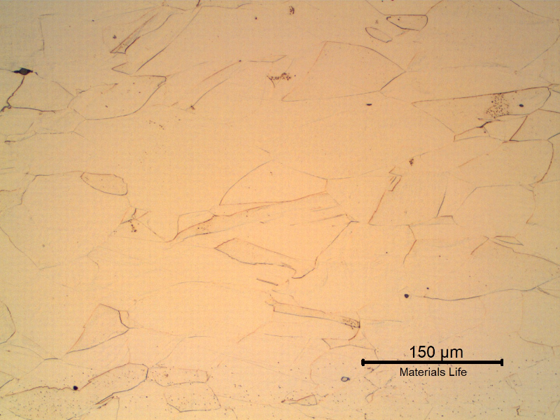 Optical micrography of the longitudinal section of the drill collar, in the center of the thickness, presenting slightly elongated grains of fully austenitic microstructure, cold worked.