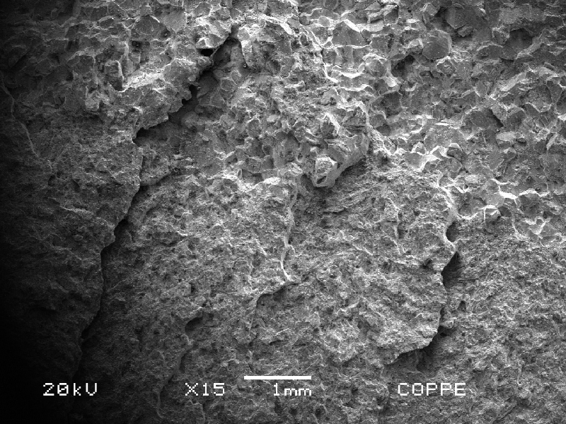 Fracture micromechanism changing from intergranular to transgranular, as the fracture is propagating.