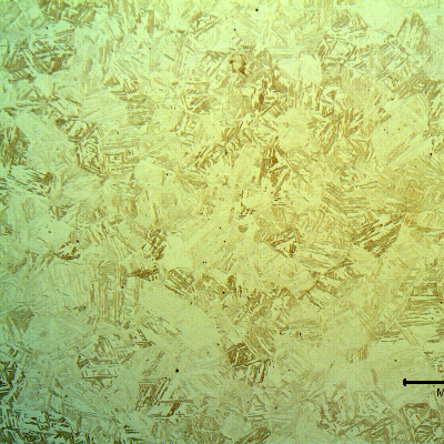 Microstructure of the spring in a transverse section, presenting an aged martensitic structure.
