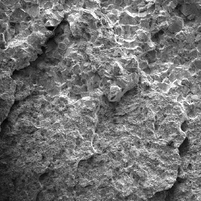Fracture micromechanism changing from intergranular to transgranular, as the fracture is propagating.