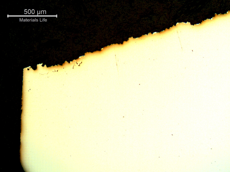Micrography of a longitudinal section of the bolt, close to the fracture surface (top of the figure),  The fracture started at the surface (left side) in a position close to the bolt body to bolt head transition.