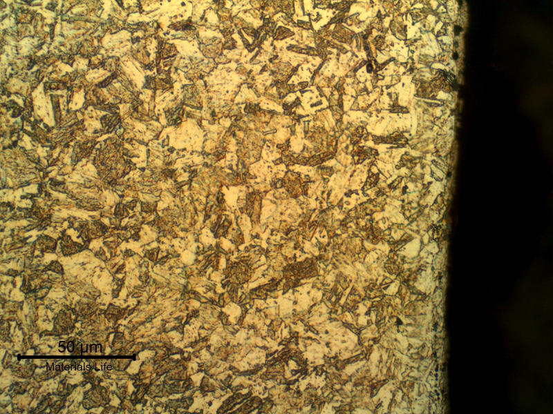 Micrographic detail of the aged martensite structure, refined when compared to the structure in the center of the bolt.
