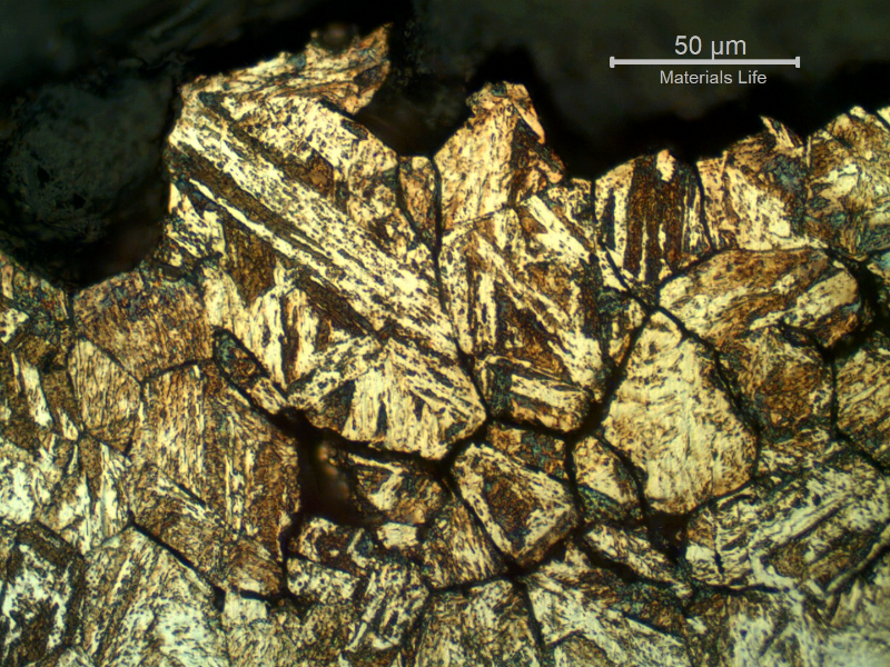 Micrographic detail of the secondary intergranular cracks (in the previous austenite grain boundaries).