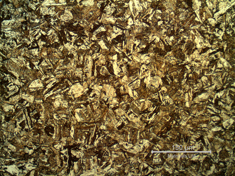 Micrography of a longitudinal section, in the center of a non-broken bolt that operated in the same assembling, presenting an aged martensitic structure, similar to the broken bolt.