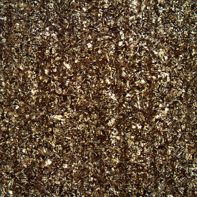 Micrography of a longitudinal section, in the center, of the broken 5/8" bolt, presenting an aged martensitic structure. There are vertical "lines" that correspond to segregation bands due to the forming direction.  These bands are evident only using low magnification microscopy.