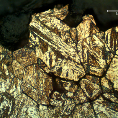 Micrographic detail of the secondary intergranular cracks (in the previous austenite grain boundaries).