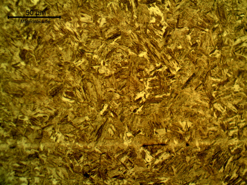 Micrographic detail of the high hardness martensitic structure. Exactly in the middle of the plate it is possible to see some aligned inclusions.