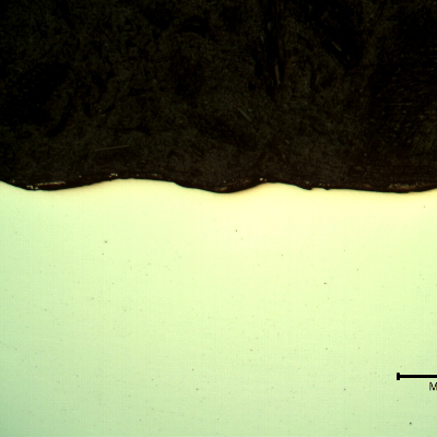 Micrography of the plate section, as polished, close to the surface that suffered the impact.  No evidences of damage.