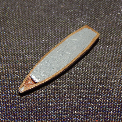 Aspect of a typical .308 Winchester projectile, similar to the one adopted to shot the plate, cut in a longitudinal section. It is a Cu alloy case filled with Pb-Sb.