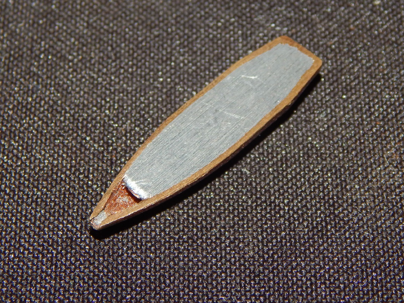 Aspect of a typical .308 Winchester projectile, similar to the one adopted to shot the plate, cut in a longitudinal section. It is a Cu alloy case filled with Pb-Sb.