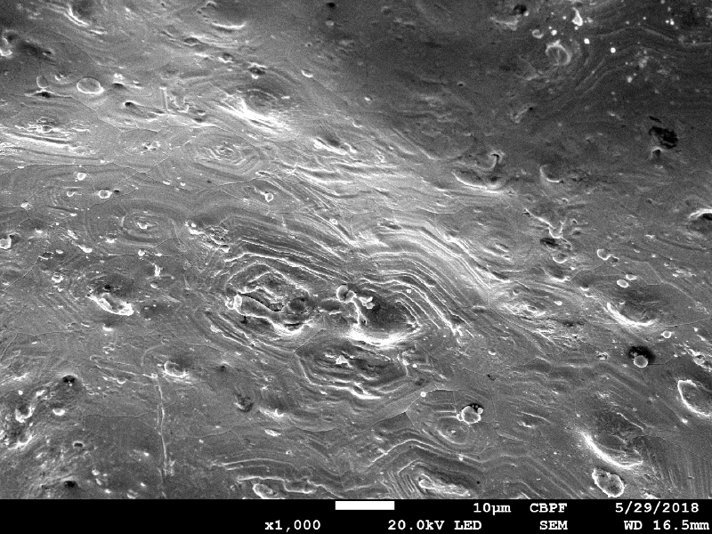 Detailed aspect of the surface of the plate, out of the center of the projectile impact position, showing that the melted bullet covered a large part of the surface.