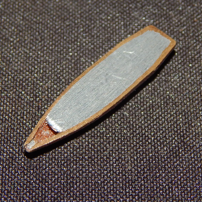 Aspect of a typical .308 Winchester projectile, similar to the one adopted to shot the plate, cut in a longitudinal section. It is a Cu alloy case filled with Pb-Sb.