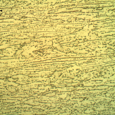 Micrographic detail of the plate, showing the aligned beta (dark phase) in alpha microstructure. Etched with HF+ HNO3+H2O solution.