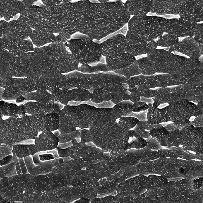 Micrography by SEM of the plate in the middle of the thickness, showing the alpha microstructure (dark grains) and the beta phase (light). Etched with HF+HNO3+H2O.