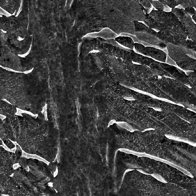 Micrographic detail by SEM of the shearing of the localized shrearing, HF+HNO3+H2O chemical etch.