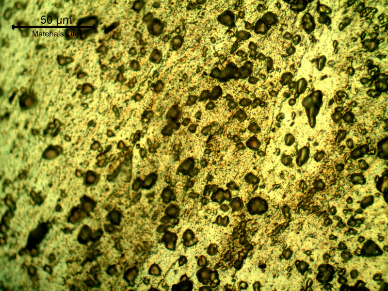 Micrographic detail of the plastically deformed microstructure at the side of the bullet impact, top of the figure. The perforated hole expulsed the material to the top and bottom directions.