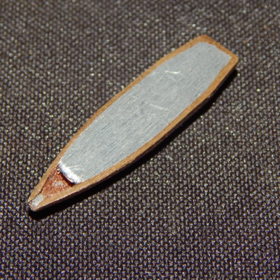 Aspect of a typical .308 Winchester projectile, similar to the one adopted to shot the plate, cut in a longitudinal section. It is a Cu alloy case filled with Pb-Sb.