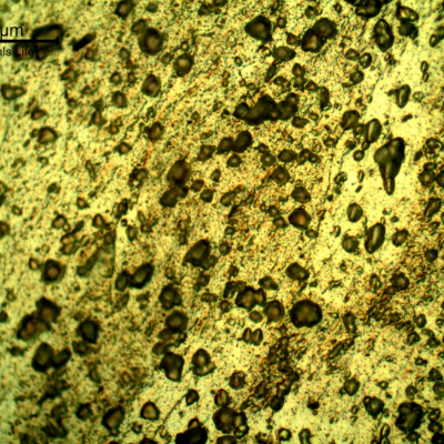 Micrographic detail of the plastically deformed microstructure at the side of the bullet impact, top of the figure. The perforated hole expulsed the material to the top and bottom directions.
