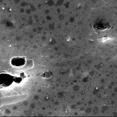 Micrographic detail, by scanning electron microscopy, of the precipitation hardened granular structure.  The stains are preferential etch of second particles.