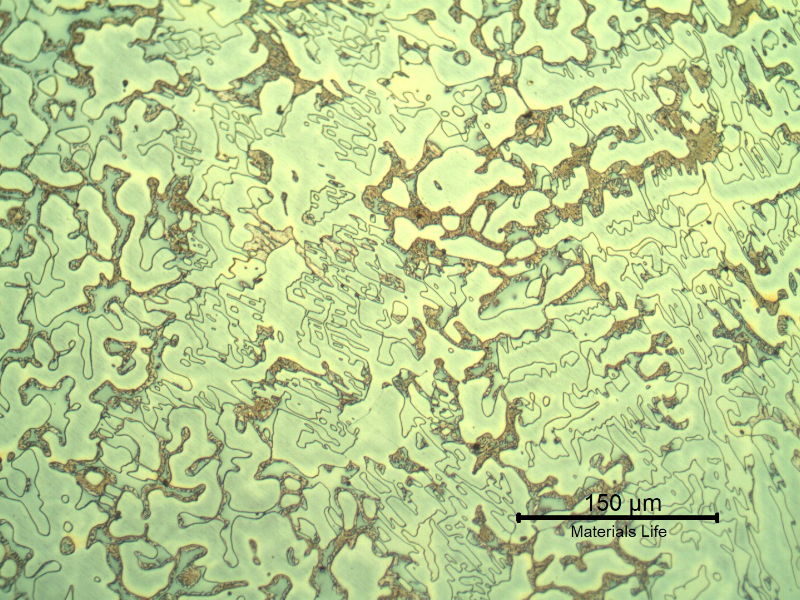 Micrography of the longitudinal section of the cast sleeve in the middle of the thickness. The microstructure is duplex, austenitic and ferritic. The etch presents different colours for the phases. The yellow is associated to detrimental phases, like sigma, at the ferritic phase (ligh blue) and the white phase is the austenite.
