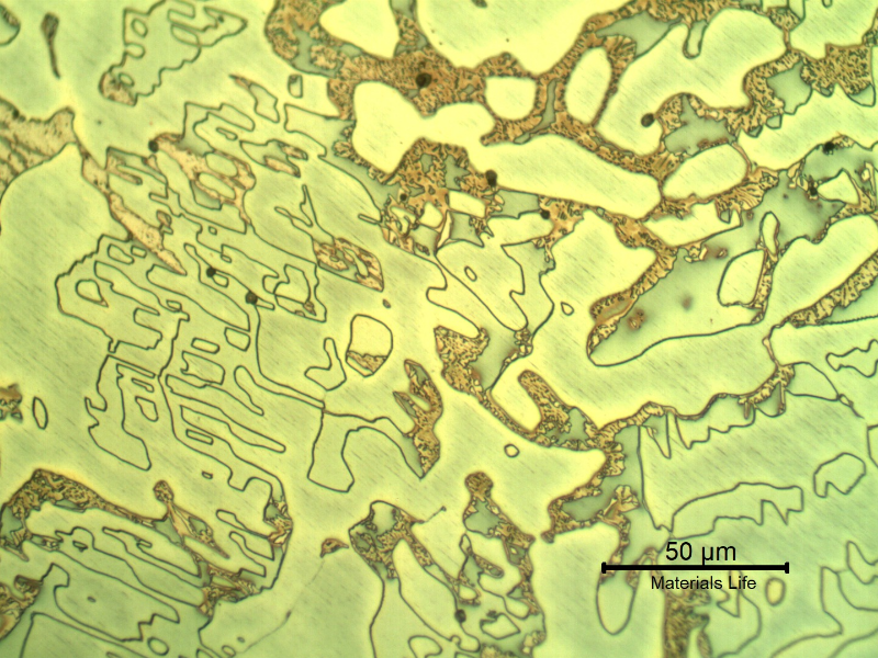 Micrographic detail of the longitudinal section of the cast sleeve in the middle of the thickness. The microstructure is duplex, austenitic and ferritic.  The etch presents different colours for the phases.  The yellow is associated to detrimental phases, like sigma, at the ferritic phase (ligh blue) and the white phase is the austenite.