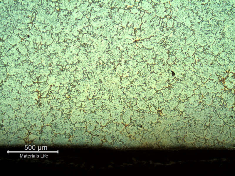 Micrography of the longitudinal section of the cast sleeve, close to the internal diameter (ID). The microstructure is coarse, austenitic ferritic, and presents the same microstructure, ferritic and austenitic, all through the thickness.