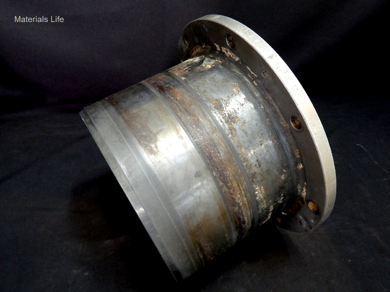 General view of the 10" diameter flanged sleeve, 1/2" wall thickness, manufactured by centrifugal casting of lean duplex stainless steel (DSS), Alloy 2304 (without Mo), with an external coating applied by thermal spray (TS).  The sleeve is assembled in a shaft. The internal environment is oil and a seal box is assembled in the external side that is wet with seawater.